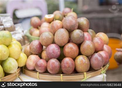 passionfruit or maracuja at a market in the city of Chiang Rai in North Thailand.. THAILAND CHIANG RAI MARKET FRUIT PASSIONFRUIT