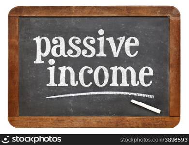 passive income sign - white chalk text on a vintage slate blackboard