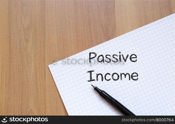 Passive income text concept write on notebook with pen