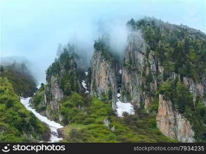 Passo del San Gottardo (or St. Gotthard Pass) summer misty view (Switzerland).