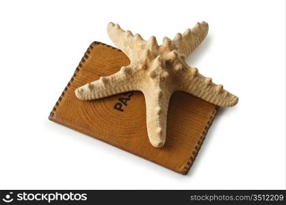 passport and starfish isolated on a white background