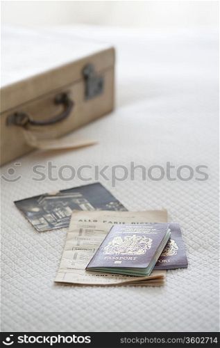 Passport and tickets with suitcase