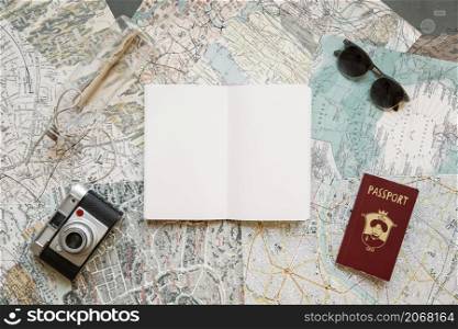 passport with camera notepad maps