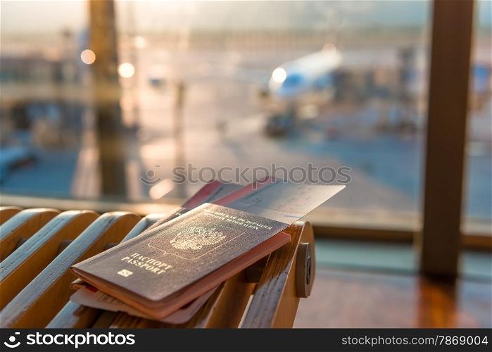 passports and tickets on a background of an airplane