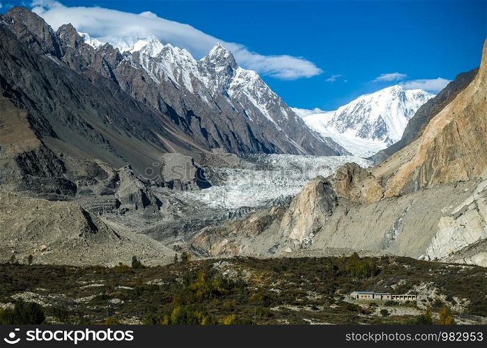 Passu glacier surrounded by snow capped mountains in Karakoram range. Gojal valley. Gilgit Baltistan, Pakistan.
