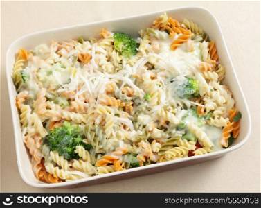 Pasta and broccoli bake, with fusilini tricolori , bechamel sauce and grated parmesan all in a ceramic baking dish