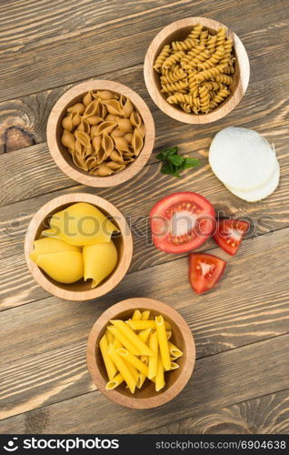 Pasta and vegetables gathered for making an Italian Dinner