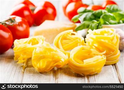 pasta and vegetables on wooden table