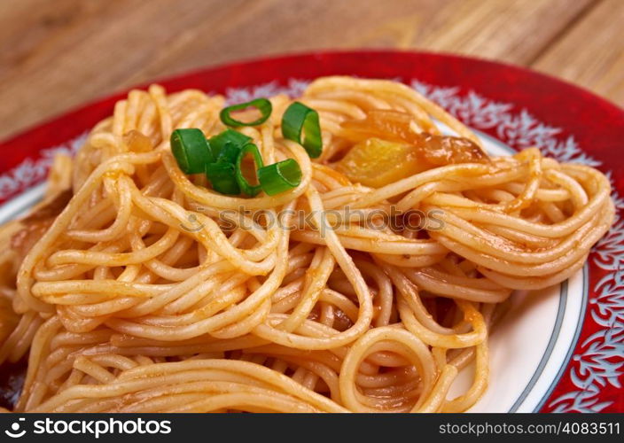 Pasta asciutta - pastasciutta cooked pasta is plated and served with a complementary sauce or condiment