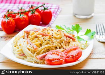Pasta carbonara on the white plate closeup