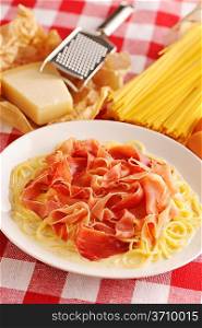 Pasta carbonara over red cloth