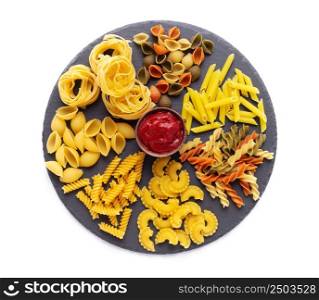 Pasta collection food isolated at white background. Raw pasta assortment on slate stone tabletop