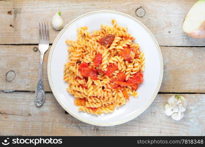 Pasta dish - cooked fusili with tomato and pepper sauce