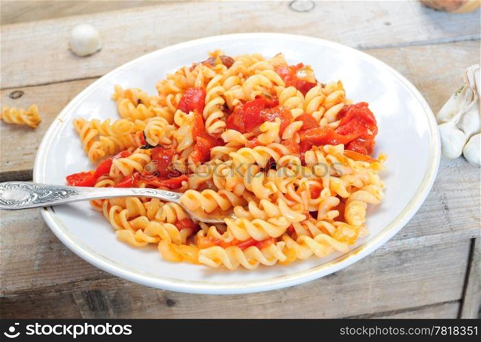 Pasta dish - cooked fusili with tomato and pepper sauce
