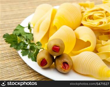 pasta on a plate, with olives