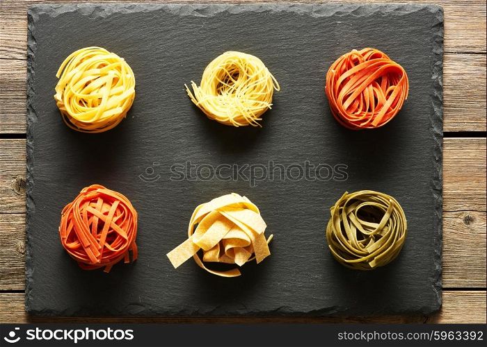 Pasta tagliatelle set over slate background