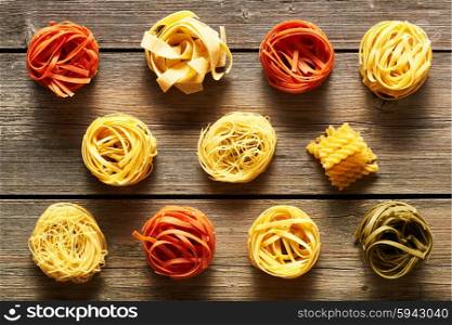 Pasta tagliatelle set over wooden background
