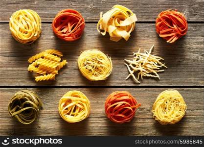 Pasta tagliatelle set over wooden background