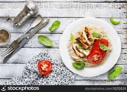 pasta with baked chicken and fresh tomato
