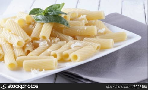 Pasta with cheese and basil, horizontal image