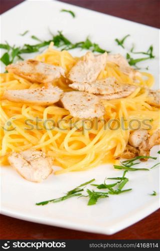 Pasta with chicken meat and greens tasty dish