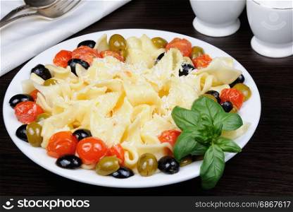 Pasta with olive, garlic, basil and tomatoes and seasoned with Parmesan cheese.