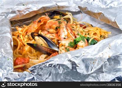pasta with oysters and tomato in foil