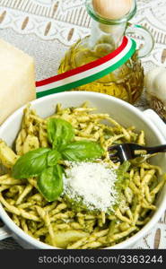 pasta with pesto on white plate