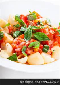 Pasta with sauce from fresh tomatoes and basil, close up