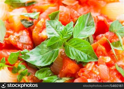 Pasta with sauce from fresh tomatoes and basil, close up