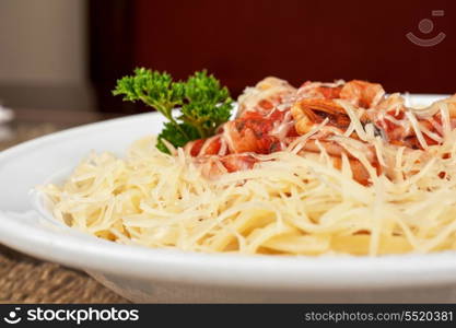 Pasta with seafood, greens and cheese