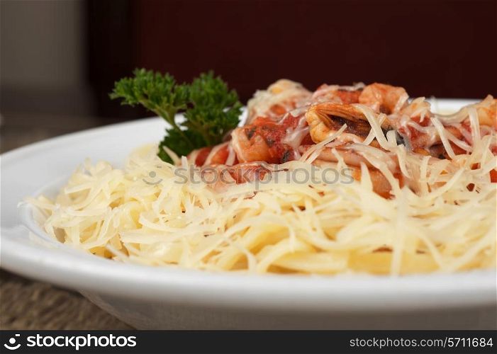 Pasta with seafood, greens and cheese