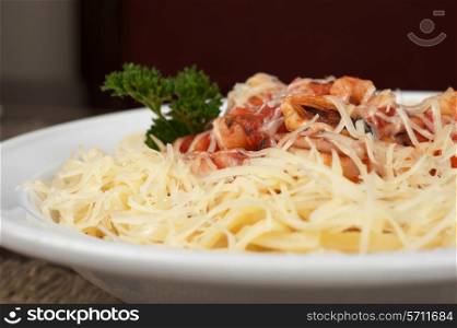 Pasta with seafood, greens and cheese