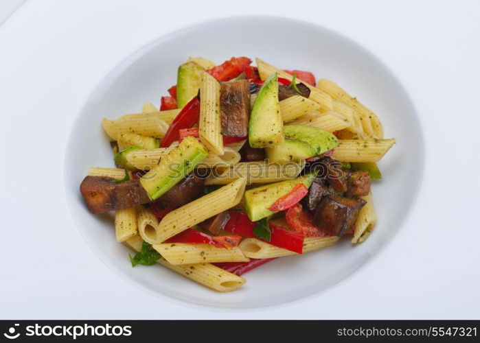 Pasta with shrimps, herbs and mashrooms isolated on white background in studio