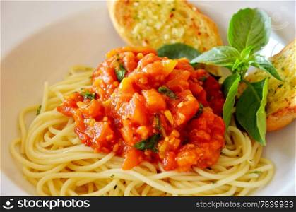 pasta with tomato sauce and meat and garlic bread
