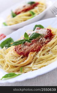 Pasta with tomato sauce basil and grated parmesan