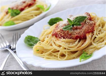 Pasta with tomato sauce basil and grated parmesan
