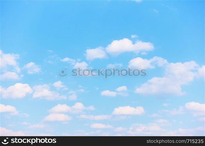 Pastel blue spring sky with light white clouds - Natural background