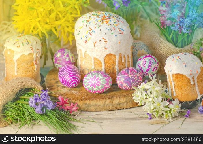Pastel Easter egg. Pastel colored decorated easter eggs and Easter cake. Pastel colored Easter holiday background.. Pastel and colorful easter eggs and Easter cake. Easter eggs painted in pastel colors
