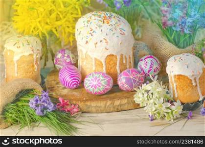 Pastel Easter egg. Pastel colored decorated easter eggs and Easter cake. Pastel colored Easter holiday background.. Pastel and colorful easter eggs and Easter cake. Easter eggs painted in pastel colors