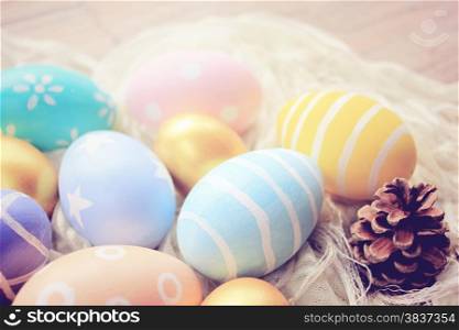 Pastel easter eggs on cloth with retro filter effect