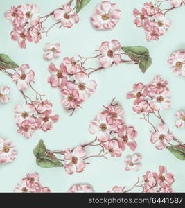 Pastel floral pattern with pink blossom flowers, top view, flat lay