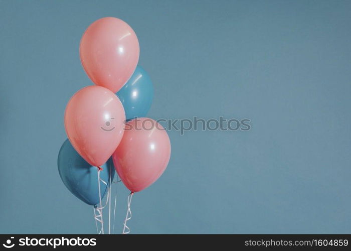 Pastel pink and blue balloons