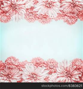 Pastel pink flowers frame on pale blue background, top view. Floral layout or mock up , horizontal