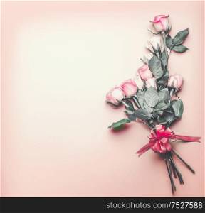 Pastel pink roses bunch with ribbon. Romantic background. Valentines day greeting card. Flowers bouquet