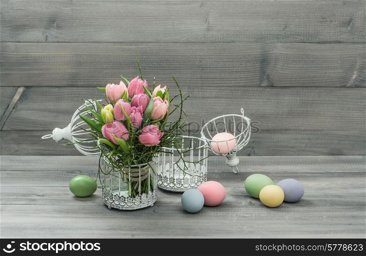 pastel pink tulip flowers and easter eggs. retro style colored picture