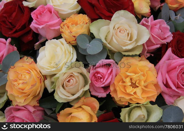 Pastel rose bouquet with red rose accents