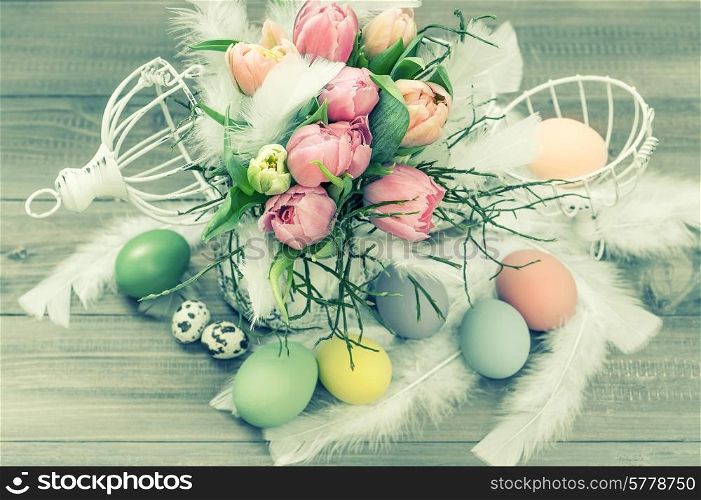 pastel tulip flowers and easter eggs. retro style colored picture. selective focus
