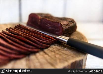 pastrami knife on a wooden table