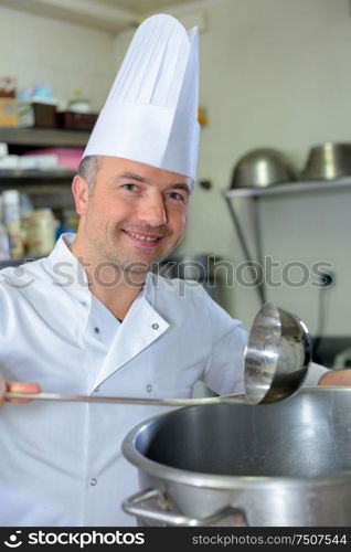 pastry chef holding delicious looking cakes and pastries